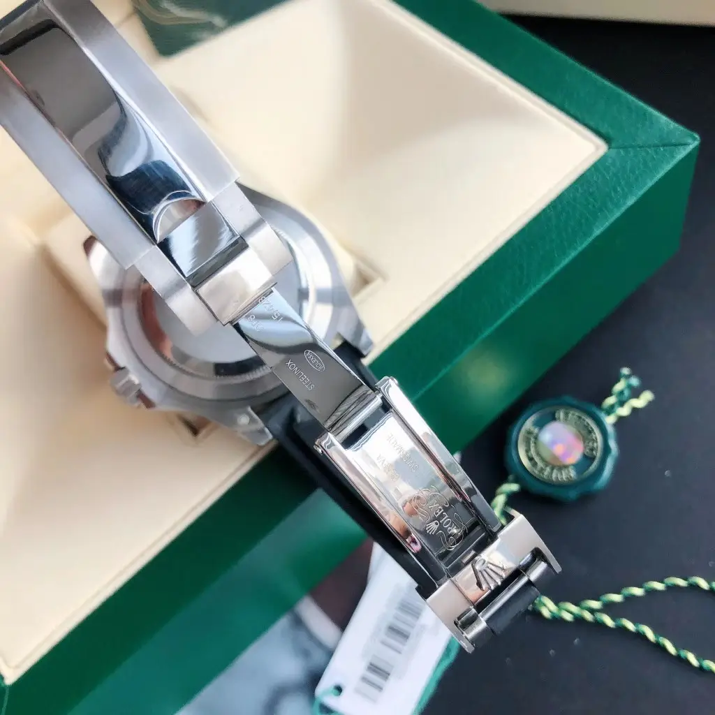 Rolex Submariner 116610LN black dial ceramic bezel stainless steel watch with deployment clasp and green box background