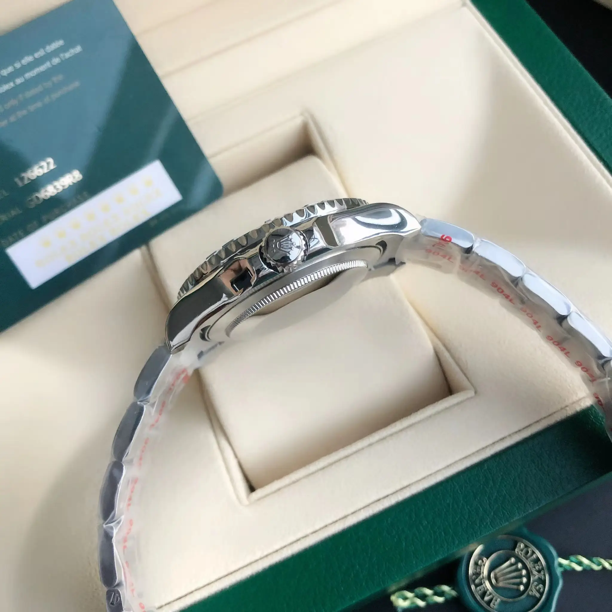 Rolex Submariner 116610LN black dial ceramic bezel stainless steel watch side view with crown detail and box interior