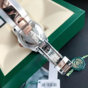 Rolex GMT-Master II black dial rose gold and stainless steel bezel stainless steel watch clasp close-up