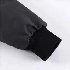 Repsgoat black nylon jacket sleeve with black ribbed knit cuff detail