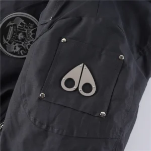 Moose Knuckles jacket black fabric metal logo patch with rivet detailing