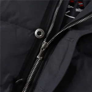 Close-up of Moose Knuckles Men's Original 3Q Shearling Trim Down Jacket zipper and fabric details, showcasing high-quality craftsmanship and design.