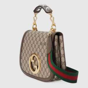 Gucci Beige and Brown GG Supreme Canvas handbag with Double G interlocking design, featuring golden hardware, stud handle, and green-red-green canvas strap.