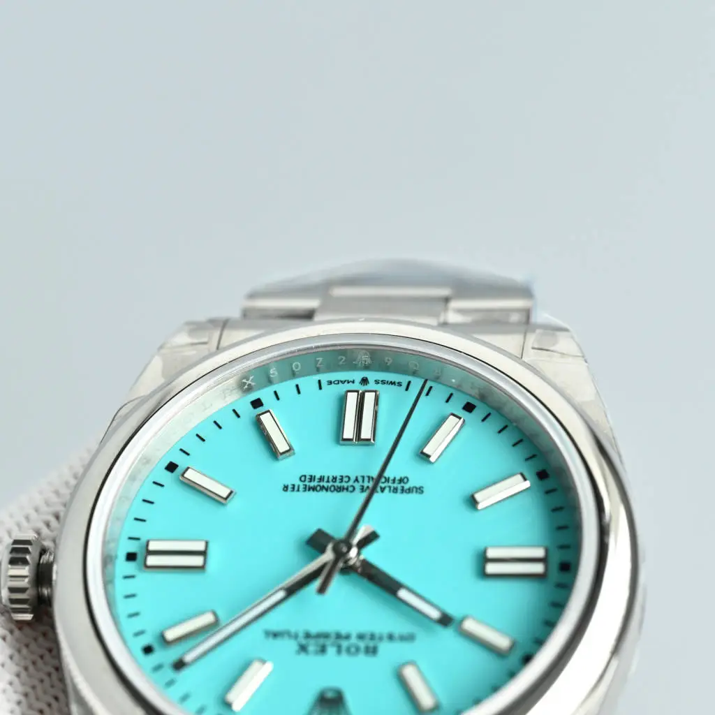 Rolex Oyster Perpetual 124300 turquoise dial stainless steel watch with smooth bezel and Oyster bracelet