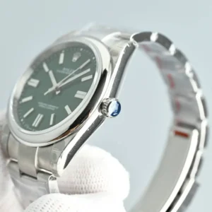 Rolex Oyster Perpetual 39mm green dial stainless steel watch with smooth bezel and oyster bracelet