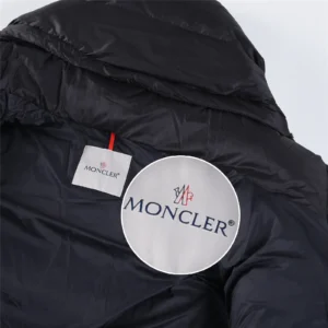 Moncler down jacket black nylon insulated winter coat with branded inner label close-up