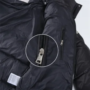 Moncler down jacket black nylon with silver zipper detail close-up