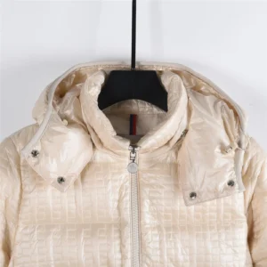Moncler Alliance: Gisor women's quilted hooded down jacket in cream color, showcasing zipper detail and stylish design.