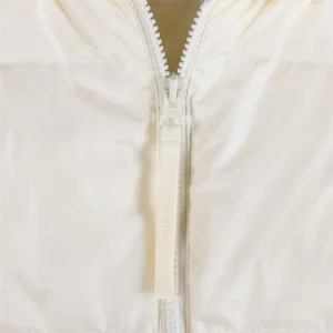 Canada Goose jacket white nylon fabric close-up zipper with brand logo pull tab