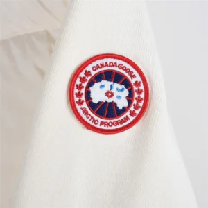 Canada Goose jacket off-white fabric with red and blue circular Arctic Program embroidered logo patch accessory