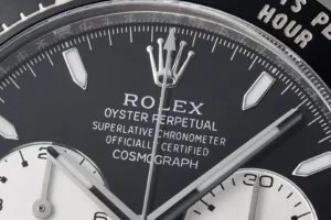 Rolex Cosmograph Daytona black dial ceramic bezel stainless steel watch close-up detail