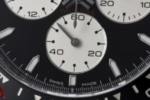 Rolex Daytona black dial ceramic bezel stainless steel watch close-up subdials and markings