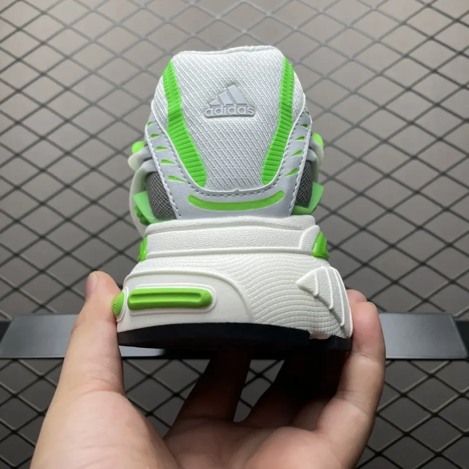 Adidas Ozweego white green mesh leather sneakers with cushioned sole and distinctive heel design