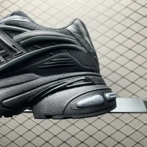 Pharrell x AD Adistar Jellyfis sneaker close-up showcasing sleek black design, textured details, and prominent sole technology.