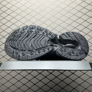 Sole of Pharrell x AD Adistar Jellyfis sneakers showcasing intricate tread design and futuristic aesthetics on a display platform.