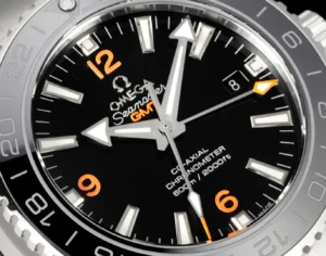 Omega Seamaster Planet Ocean GMT black dial ceramic bezel stainless steel watch with orange accents