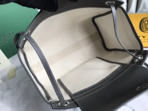 Interior view of the Goyard Rouette bag featuring a spacious design, light-colored lining, and multiple compartments for organization, emphasizing luxury and functionality.