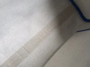 Interior view of Goyard Rouette bag showcasing fabric texture and stitching details, emphasizing craftsmanship and design features.