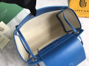 Interior view of Goyard Rouette bag showcasing blue leather and spacious compartments, emphasizing craftsmanship and versatility for fashion enthusiasts.