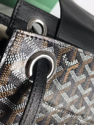 Goyard Rouette bag featuring intricate patterned fabric, leather accents, and signature logo detail.