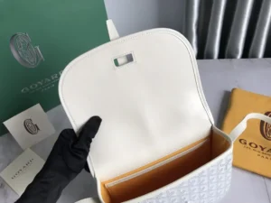 Interior view of Goyard Belv é d è re Single Mailman Bag showing leather lining, adjustable shoulder strap, and included brand packaging.