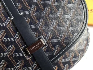 Goyard Belv é d è re Single Mailman Bag featuring signature canvas pattern, leather trim, and metal logo plate, highlighting luxury design and craftsmanship.