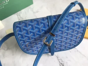 Goyard Belv é d è re Single Mailman Bag in blue, featuring signature pattern, adjustable shoulder strap, and metallic buckle, showcasing luxury replica craftsmanship.