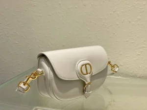 Dior Bobby East-West Bag in white leather with gold hardware, showcasing stylish design and detachable shoulder straps, ideal for versatile fashion.