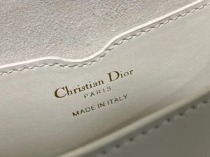 Christian Dior logo on the interior of a luxury handbag, emphasizing brand authenticity and craftsmanship, relevant to the Dior Bobby East-West Bag.