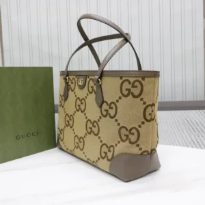 Gucci trendy business leather bag featuring signature GG monogram design, complemented by a green Gucci shopping bag.