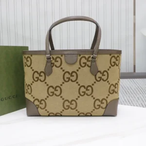 Trendy Gucci business leather tote bag featuring a brown GG logo pattern, complemented by gray leather accents and handles, set against a minimalist background.