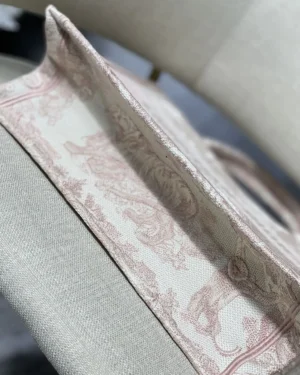 Dior Book Tote Bag featuring intricate floral and tiger motifs, showcasing its luxurious design and spacious interior.