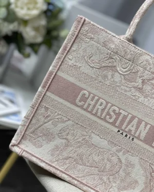 Dior Book Tote Bag featuring intricate design and "CHRISTIAN PARIS" logo, showcasing luxury craftsmanship and stylish appeal.