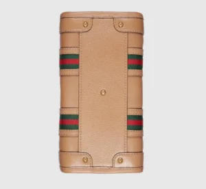 Gucci Exquisite Small Canvas Handbag featuring brown GG canvas, leather rolled edges, red and blue striped webbing, and gold adjustable accessories, showcasing luxury design elements and craftsmanship.