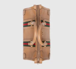 Gucci Exquisite Small Canvas Handbag featuring brown GG canvas, striped webbing, double G accessories, and leather handles, showcasing luxury design elements and craftsmanship.