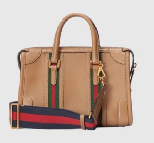 Gucci Exquisite Small Canvas Handbag featuring brown GG canvas, leather accents, red and blue striped webbing, detachable shoulder strap, and gold hardware, ideal for luxury fashion enthusiasts.