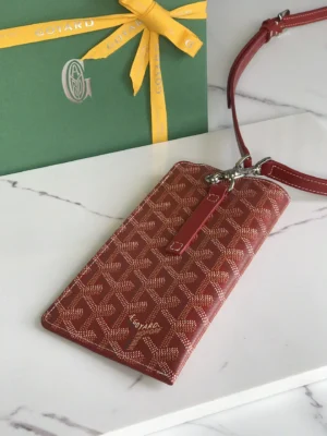Goyard cardholder red coated canvas leather strap wristlet with signature chevron pattern and silver hardware
