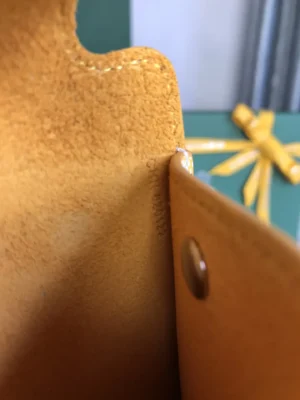 Hermès wallet brown leather small snap closure detailed interior stitching