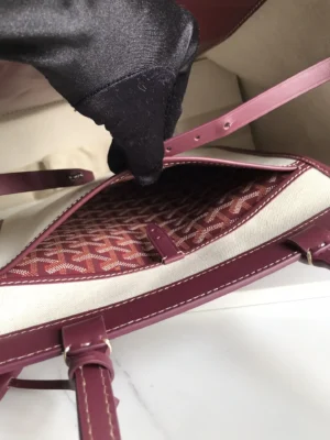 Interior view of Goyard Aude convertible tote bag showing spacious compartment, protective lining, and stylish design details.