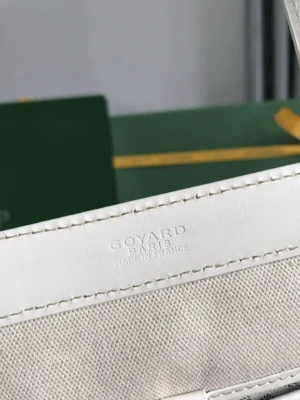 Goyard Tote Bag Commuter Series label featuring embossed logo, showcasing luxury craftsmanship and authenticity.