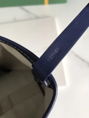Interior tag of Goyard Tote Bag Commuter Series showing identification number and blue strap, highlighting authenticity features for luxury bag enthusiasts.