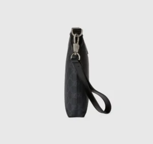 Black GG Supreme canvas Interlocking Double G Postman Bag side view with leather strap and silver hardware, showcasing luxury design features.