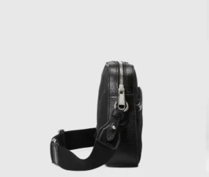 Side view of the Super Double G Postman Bag by Gucci, showcasing its sleek black design, zipper detail, and adjustable strap, featured in the 2023 Spring/Summer collection.
