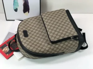Gucci backpack medium beige monogram canvas black leather trim with front zip pocket