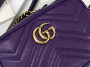 Purple Gucci GG Marmont small shoulder bag featuring Double G interlocking logo and chevron quilted leather design.