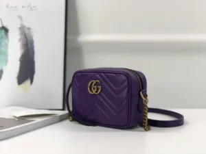 Purple Gucci GG Marmont small shoulder bag with interlocking Double G logo, showcasing quilted leather design and chain strap.