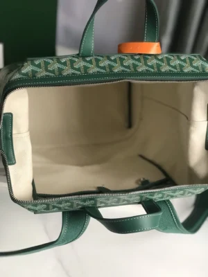 Goyard Cisalpin Backpack interior view showcasing spacious compartment, green Goyardine canvas, and structured zipper closure design.