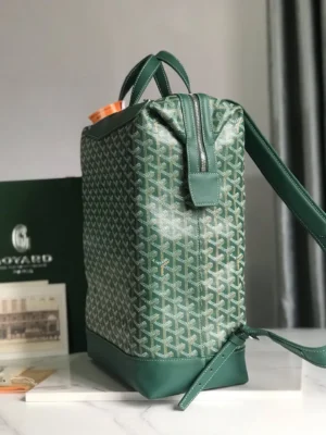 Goyard Cisalpin Backpack in green Goyardine canvas with structured zipper closure, showcasing the bag's spacious design and top layer calf leather accents, ideal for urban adventurers.