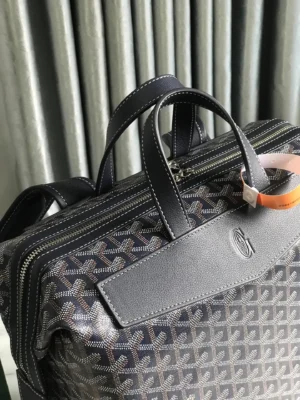 Goyard Cisalpin Backpack featuring structured zipper closure, Goyardine canvas, and top layer calf leather, suitable for urban adventurers, with dual handles and a shoulder strap.