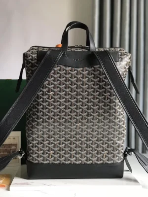 Goyard Cisalpin Backpack featuring Goyardine canvas and calf leather, designed for urban adventurers with structured zipper closure, showcasing adjustable shoulder straps and spacious interior.